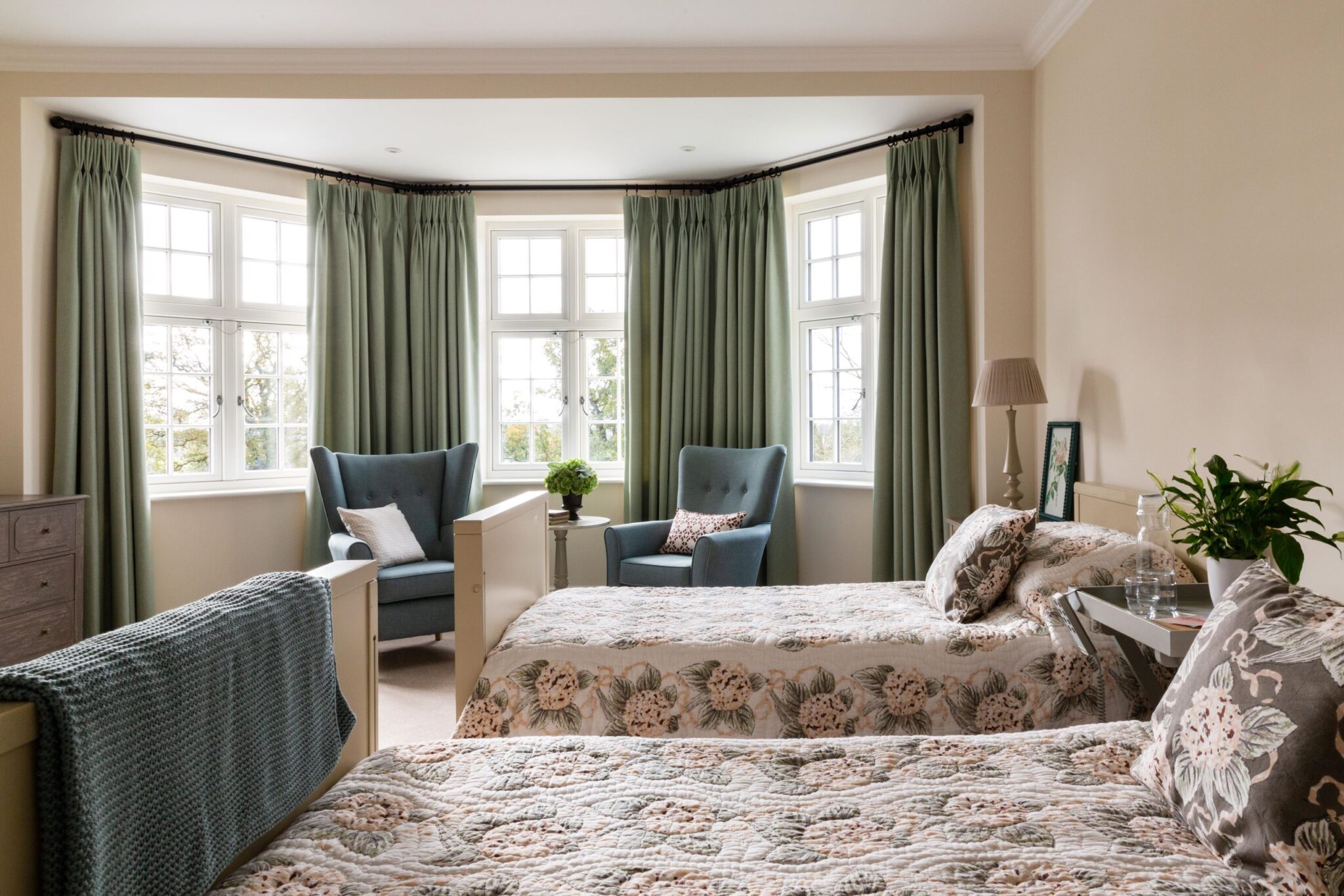 Comfortable bedroom designed for elderly residents at Elliscombe House in Somerset