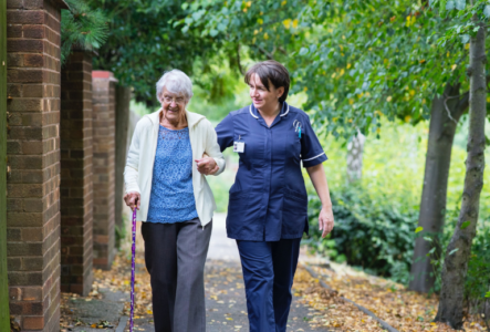 Family visiting a care home and asking questions during a tour