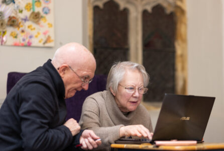 care home residents using laptop